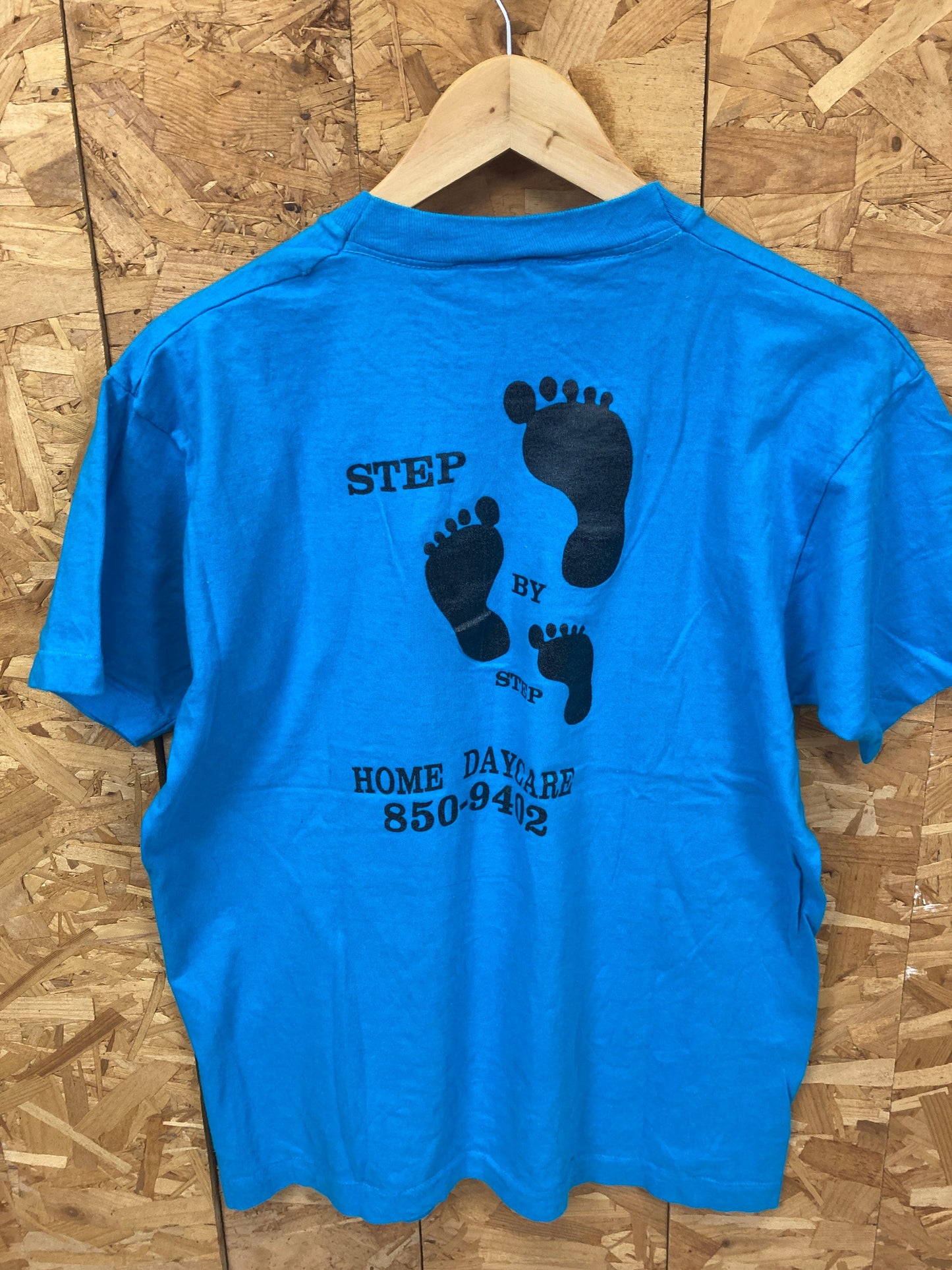 Vintage 80s quirky ‘Step by Step Daycare’ USA blue single stitch t-shirt size large