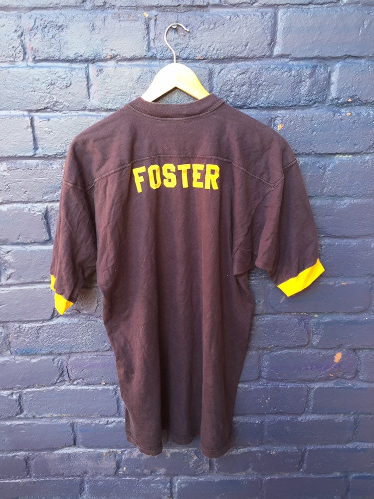 Vintage 80s NKO Foster player jersey USA college varsity souvenir navy blue distressed football t-shirt size XL