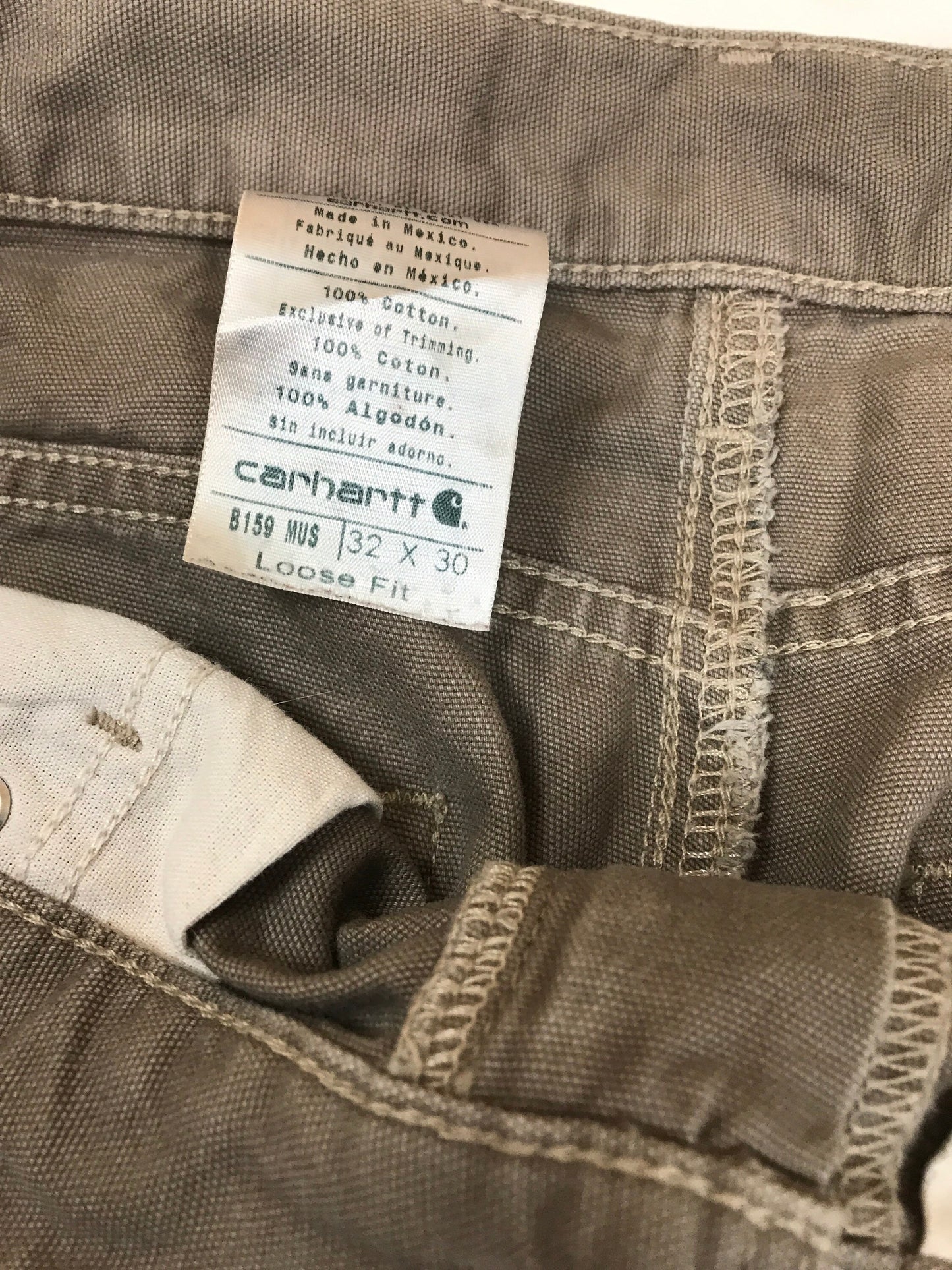 Vintage 90s distressed worn Carhartt light beige grey heavy cotton canvas duck weave workwear carpenter pants