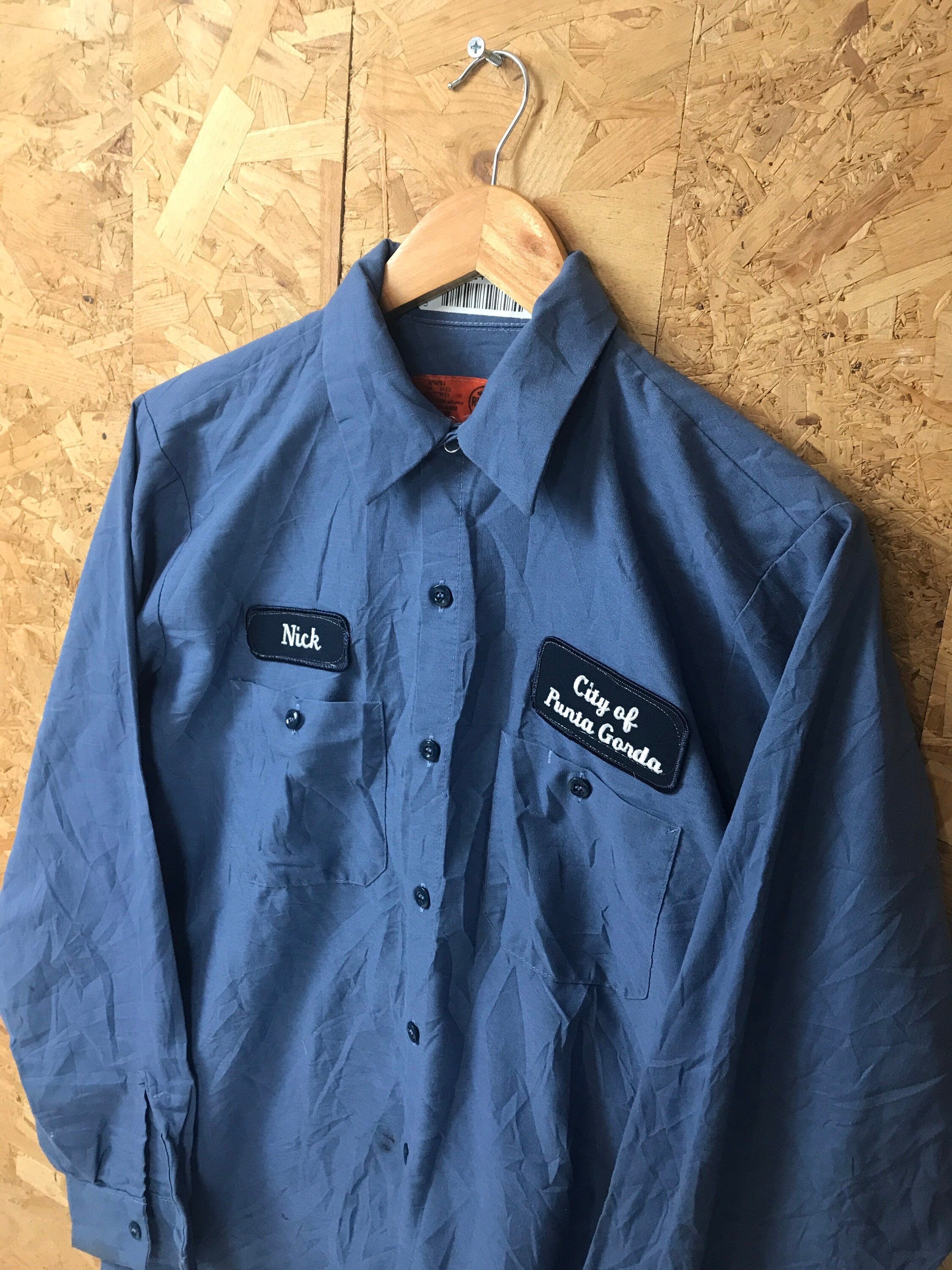 Vintage 80s USA distressed blue chore workwear workers shirt Nick city of punta gorda name badge By Redkap size medium